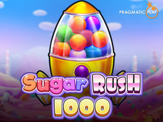 Превью игры Sugar Rush 1000 с леденцами и сладостями на разноцветном фоне
